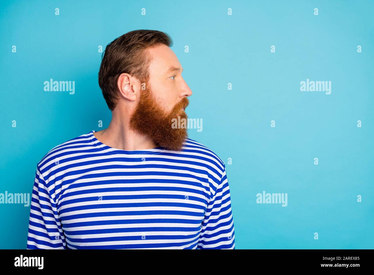 Profile side close up photo of focused attractive man look copyspace show  his skincare stubble spa salon treatment wear vest isolated over blue color  Stock Photo - Alamy