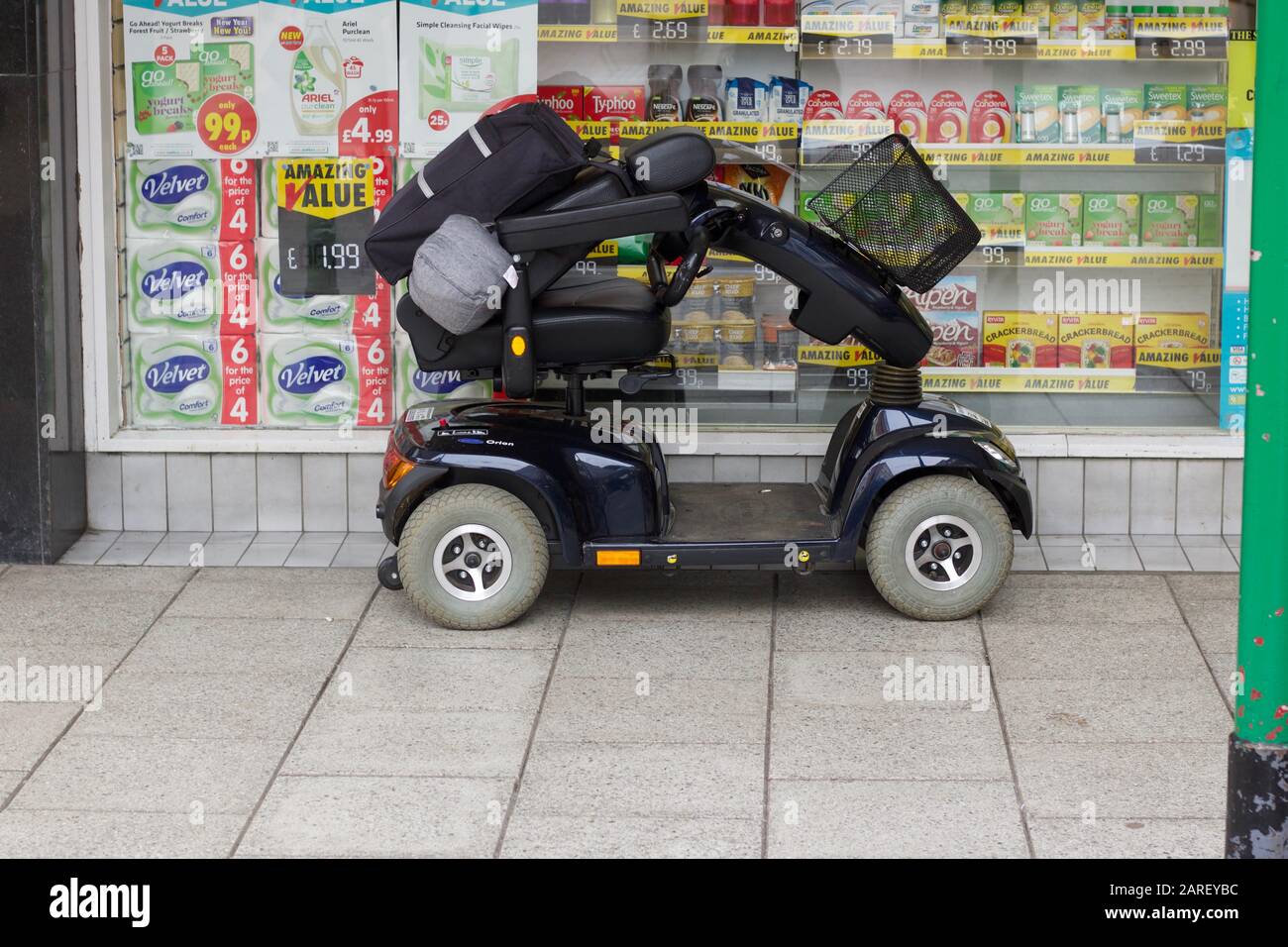 4 January 2019 - England, UK: Mobility scooter parked outside shop Stock Photo