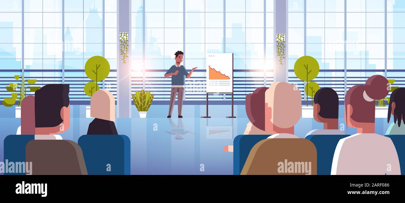 businessman presenting falling down arrow for businesspeople at ...
