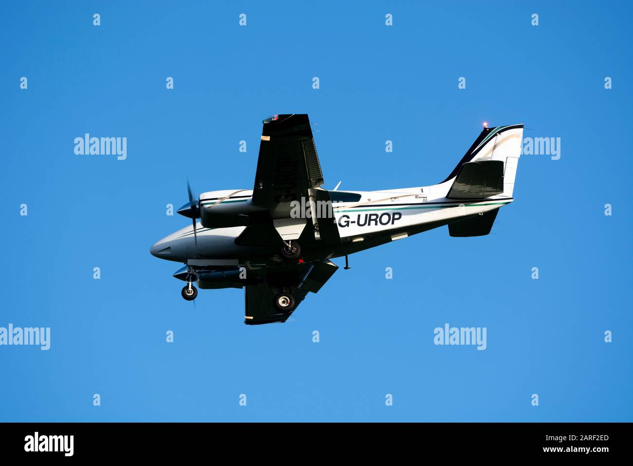 Beech 95-B55 Baron landing at Wellesbourne Airfield, Warwickshire, UK (G-UROP) Stock Photo