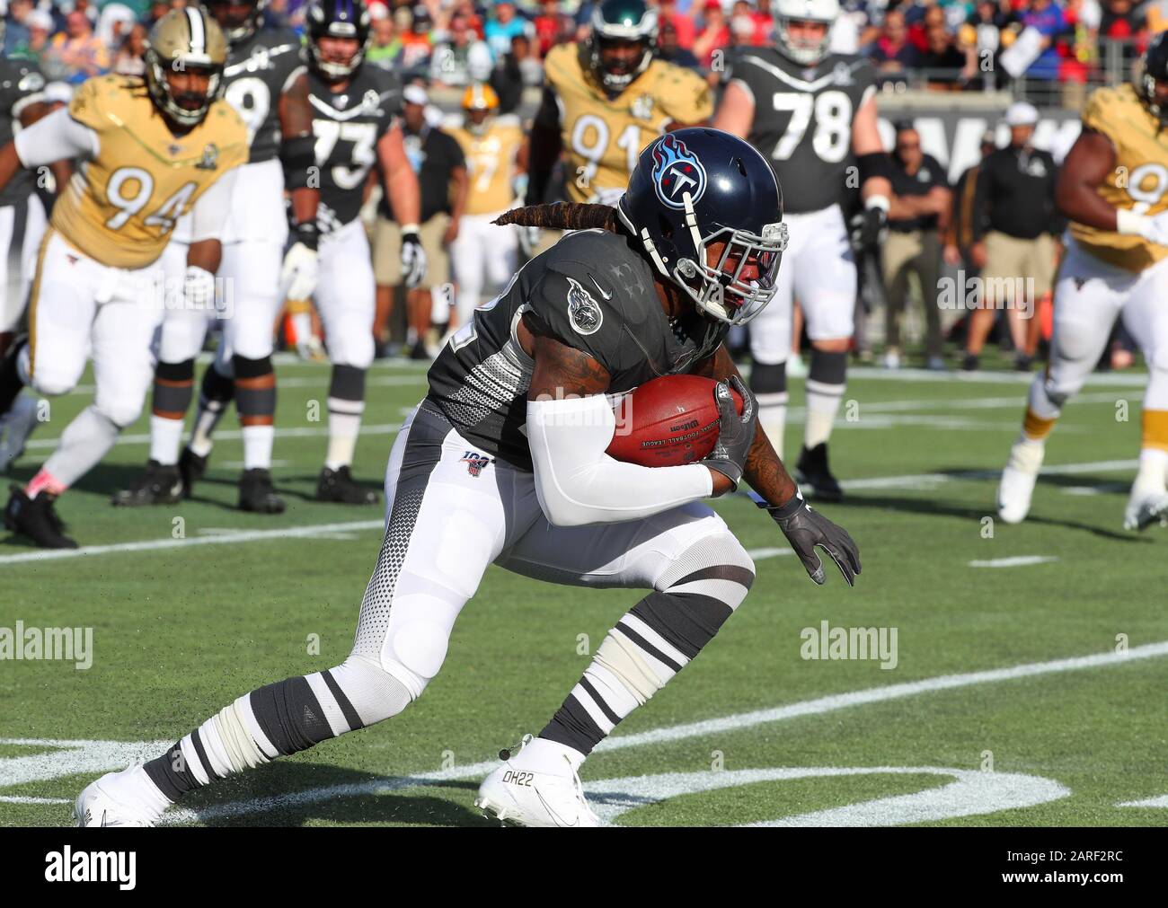 AFC running back Derrick Henry of the Tennessee Titans (22) and quarterback Lamar  Jackson of the Baltimore Ravens (8) during the Pro Bowl, Sunday, Jan. 26,  2020, at Camping World Stadium in