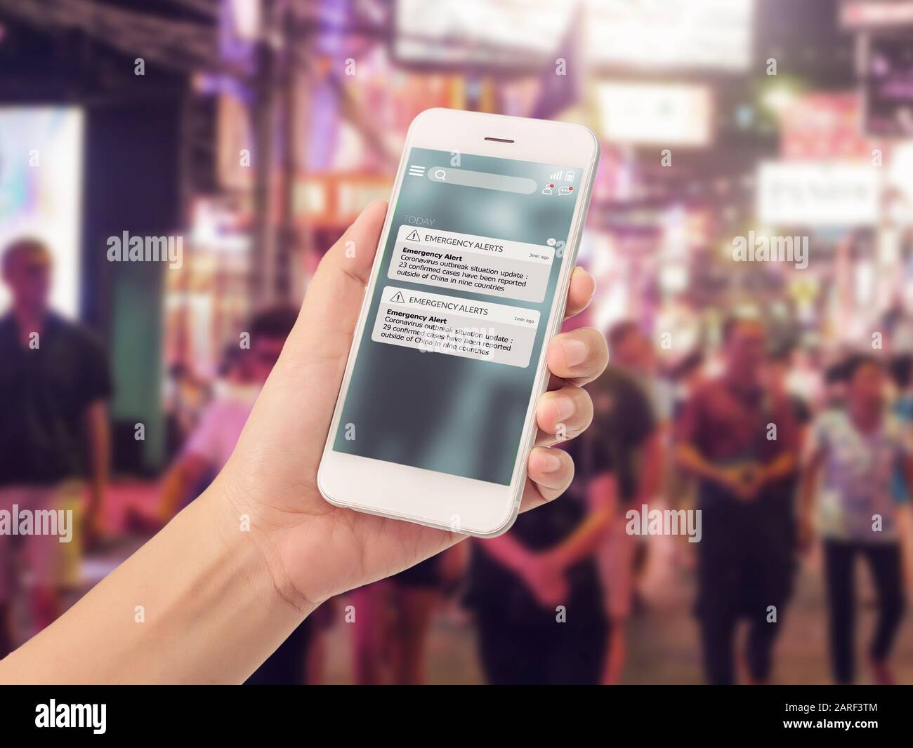 warning alert sms via smart phone for infective outbreak situation on phone screen. catastrophic situation news update system for people Stock Photo