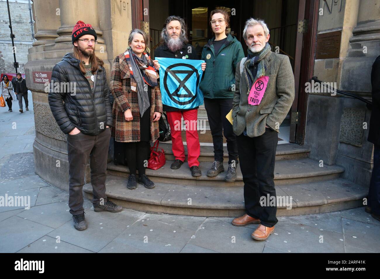 From left to right: Ben Bont (left), 42, a tree surgeon from West Wales, Claudia Fisher, 57, a business woman from Brighton, Senan Clifford, 59, a former teacher from Gloucestershire, Phoebe Valentine, 23, a maths student from Brighton, and David Lambert (right), 60, a historian from Gloucestershire, arrive at the City of London Magistrates' Court, after they were arrested on 10 October 2019, during a peaceful demonstration - in which they glued themselves to the concourse between the DLR station and City Airport in east London. Stock Photo