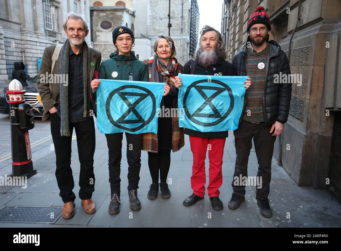 From left to right: David Lambert (left), 60, a historian from Gloucestershire, Phoebe Valentine, 23, a maths student from Brighton, Claudia Fisher, 57, a business woman from Brighton, Senan Clifford, 59, a former teacher from Gloucestershire, and Ben Bont (right), 42, a tree surgeon from West Wales, arrive at the City of London Magistrates' Court, after they were arrested on 10 October 2019, during a peaceful demonstration - in which they glued themselves to the concourse between the DLR station and City Airport in east London. Stock Photo