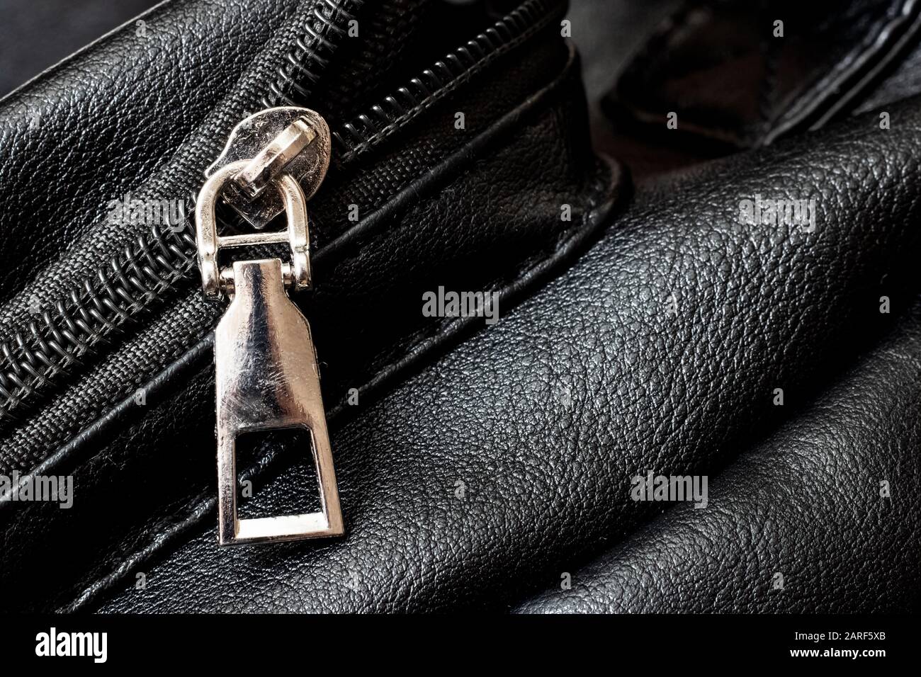 Metal clasp and zipper on leather closeup Stock Photo Alamy