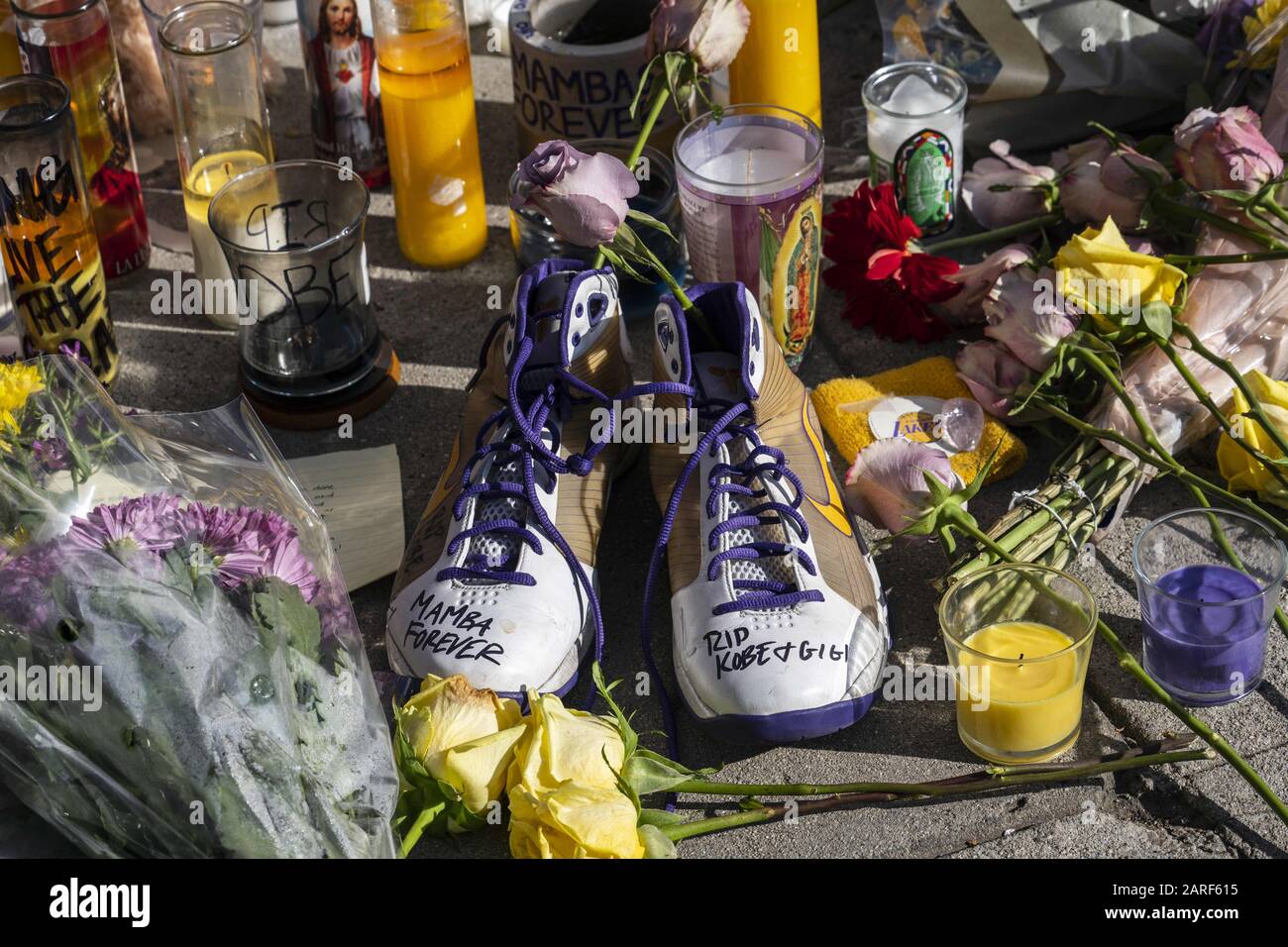 Los Angeles, California, USA. 15th Mar, 2019. Shoes, flowers and candles left by fans at a memorial of an NBA legend Kobe Bryant in Los Angeles, California.Kobe Bryant and his daughter Gianna and 7 other people died in a helicopter crash. Credit: Ronen Tivony/SOPA Images/ZUMA Wire/Alamy Live News Stock Photo