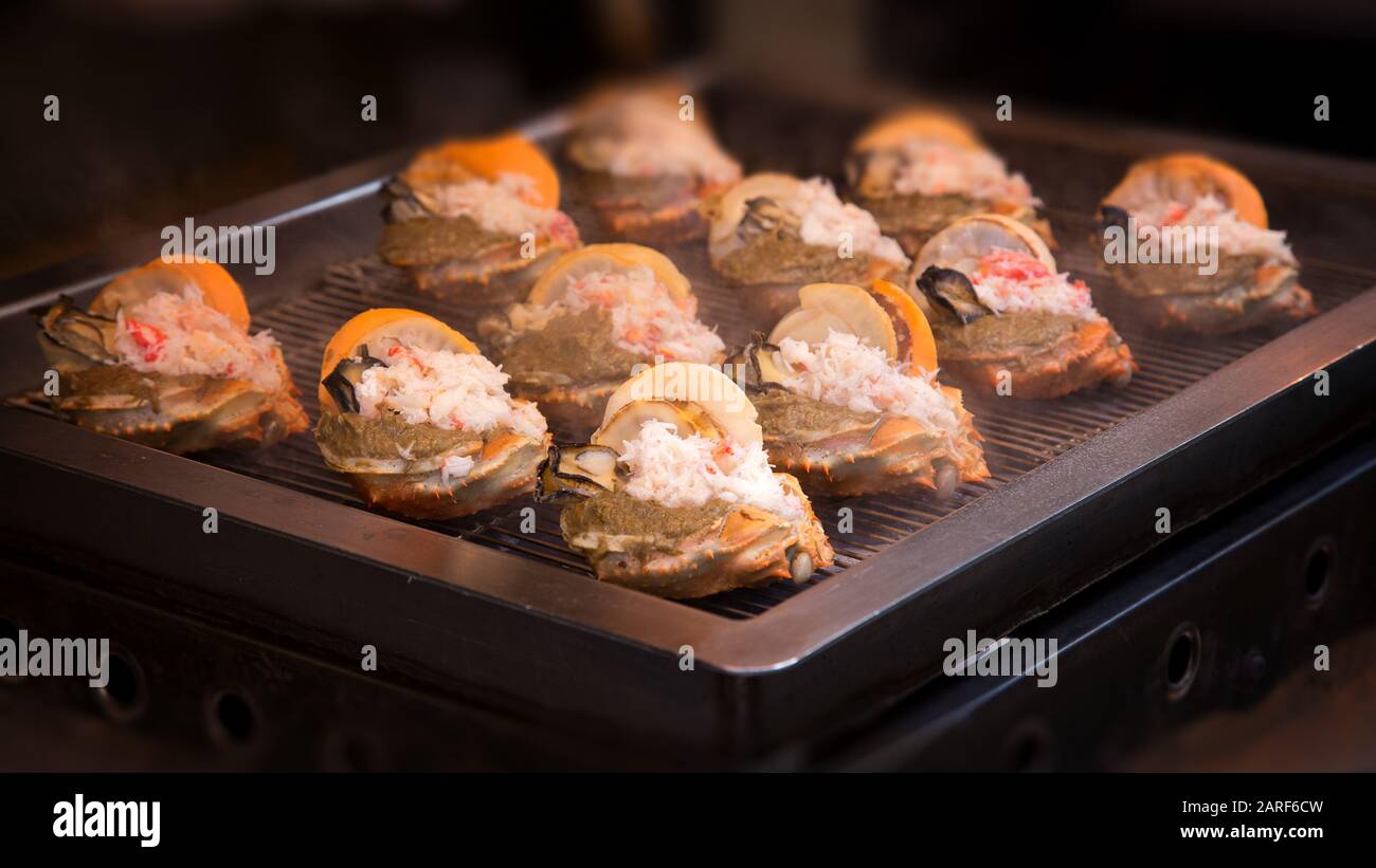 Japanese Street Food Consisting Of Griddled Crab Shell With