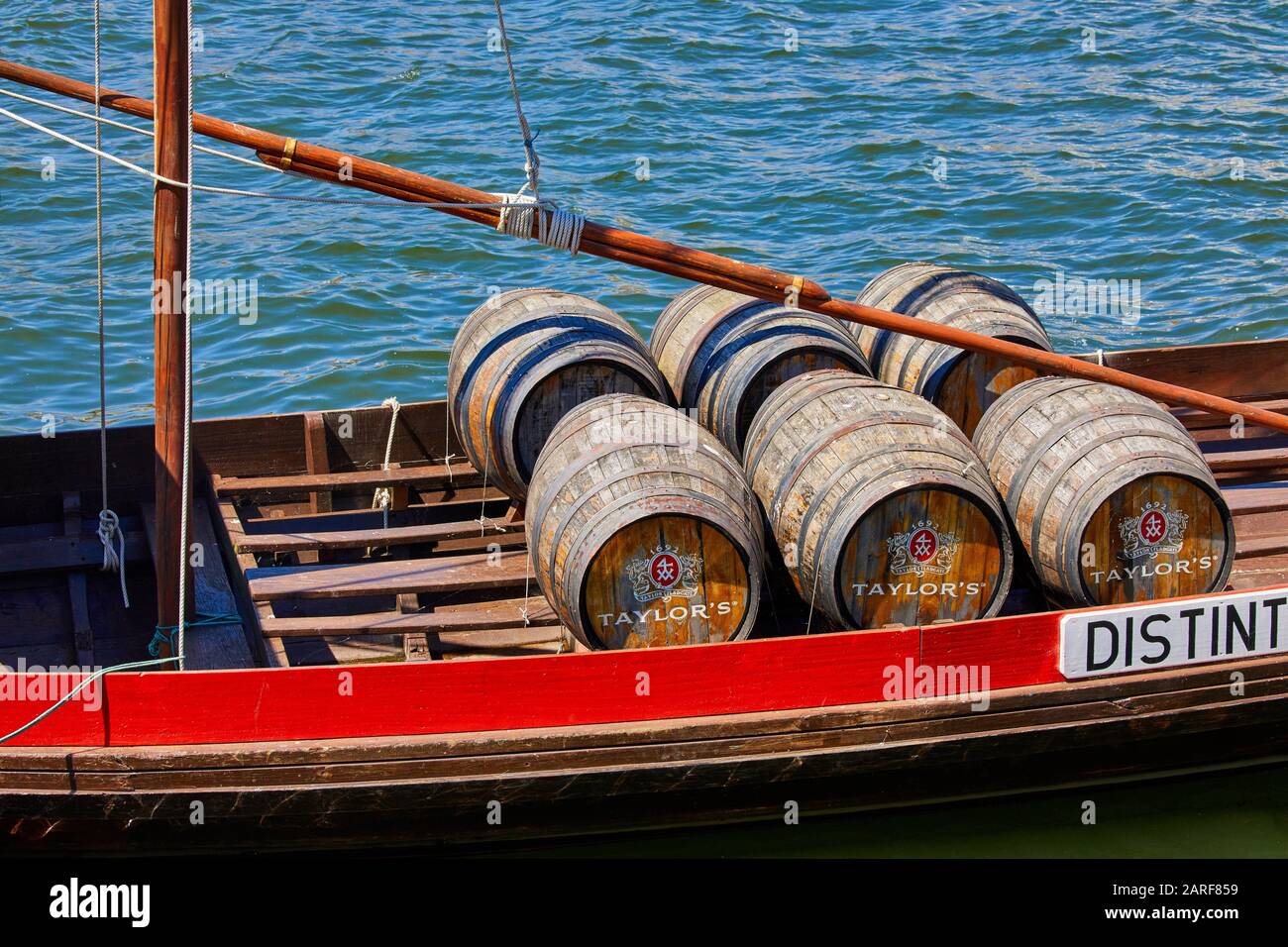 Traditional Portuguese wooden cargo boats transporting port wine, Rio Douro river, Vila Nova de Gaia, Porto, Portugal Stock Photo