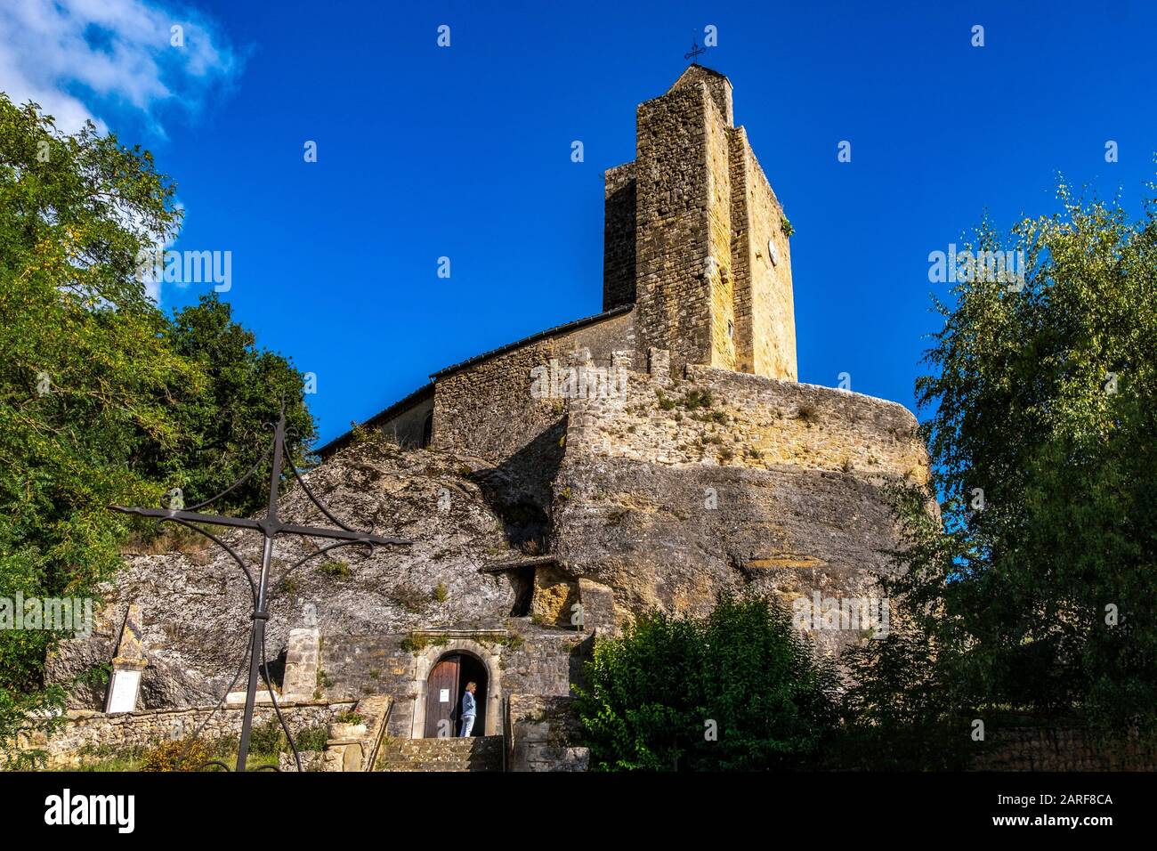 France, Occitanie, Ariege, Vals. It is known for the church ''Eglise Rupestre de Vals'' which is built into the giant rocks that make up its Stock Photo
