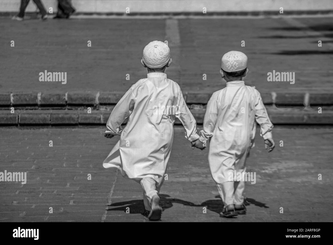 Syria, Homs, young kids going to Khaled Al-Walid mosque. Stock Photo