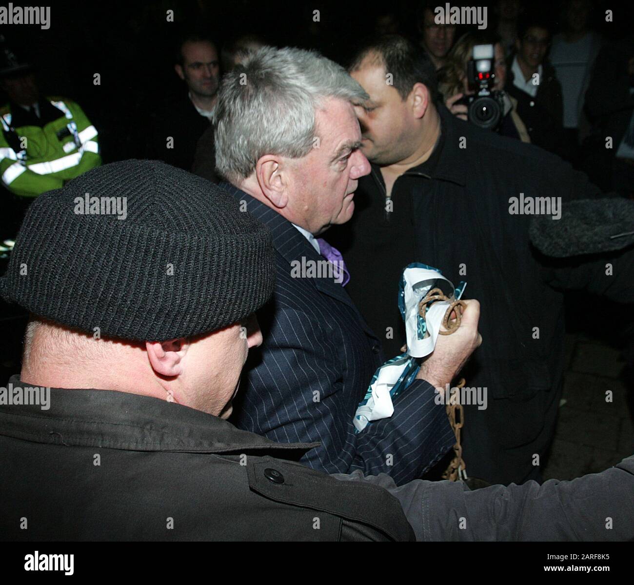 Controversial historian David Irving and BNP leader Nick Griffin  pass by demonstrators whilst attending as guest speakers the Oxford Union debating society meeting in 2007. Stock Photo