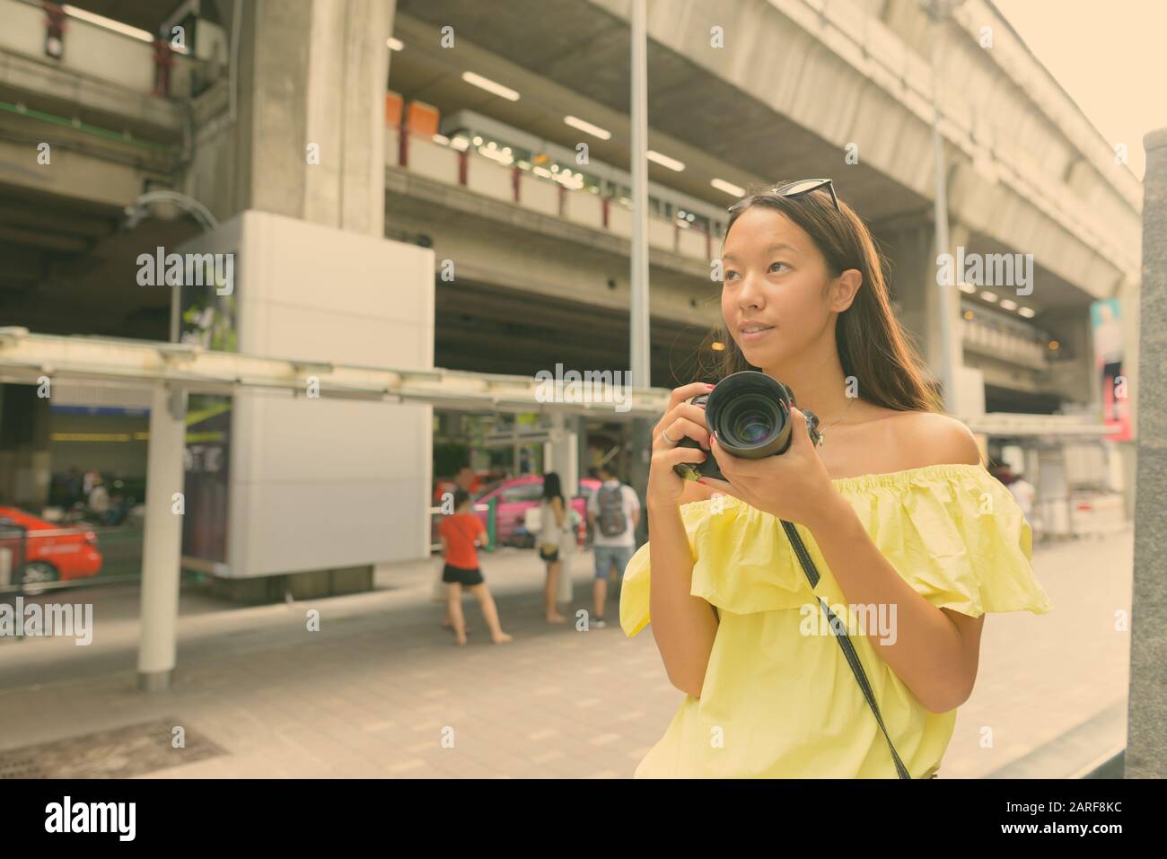 Young beautiful tourist woman exploring the city Stock Photo