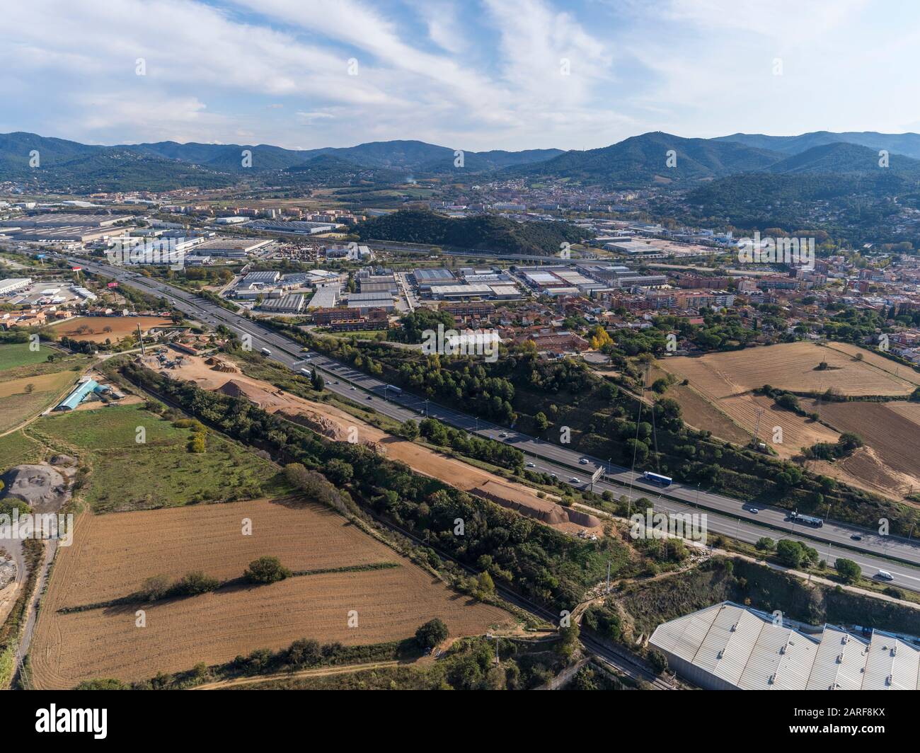 Aerial view of AP-7 highway and industrial area. Parets del Vallès. Barcelona, Spain. Stock Photo