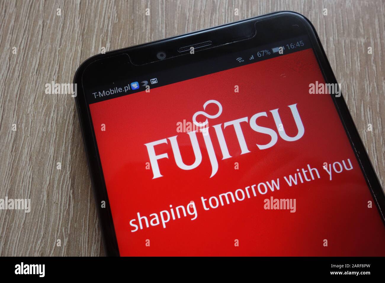 Fujitsu logo displayed on a modern smartphone Stock Photo