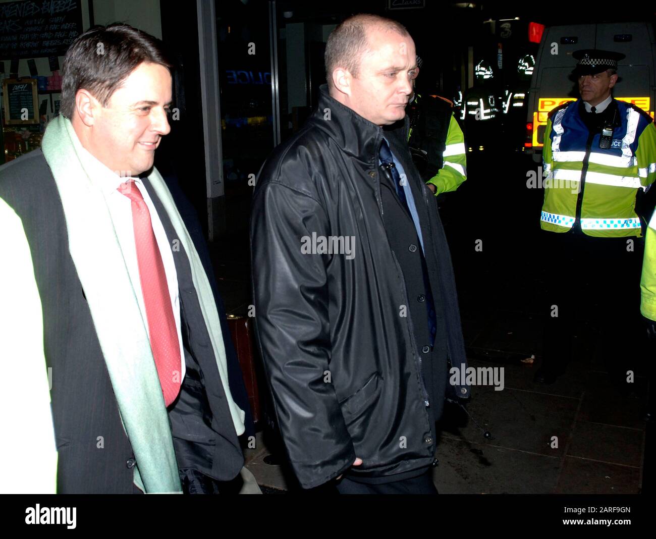 Controversial historian David Irving and BNP leader Nick Griffin  pass by demonstrators whilst attending as guest speakers the Oxford Union debating society meeting in 2007. Stock Photo