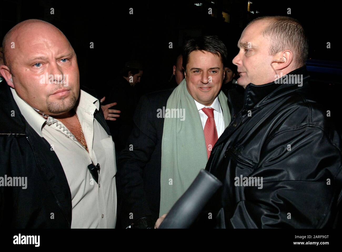 Controversial historian David Irving and BNP leader Nick Griffin  pass by demonstrators whilst attending as guest speakers the Oxford Union debating society meeting in 2007. Stock Photo