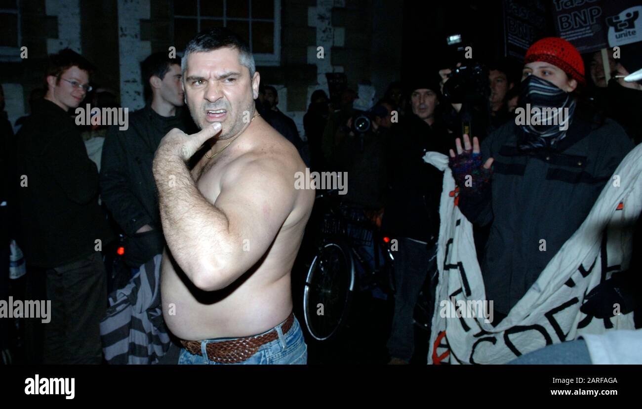 Controversial historian David Irving and BNP leader Nick Griffin  pass by demonstrators whilst attending as guest speakers the Oxford Union debating society meeting in 2007. Stock Photo