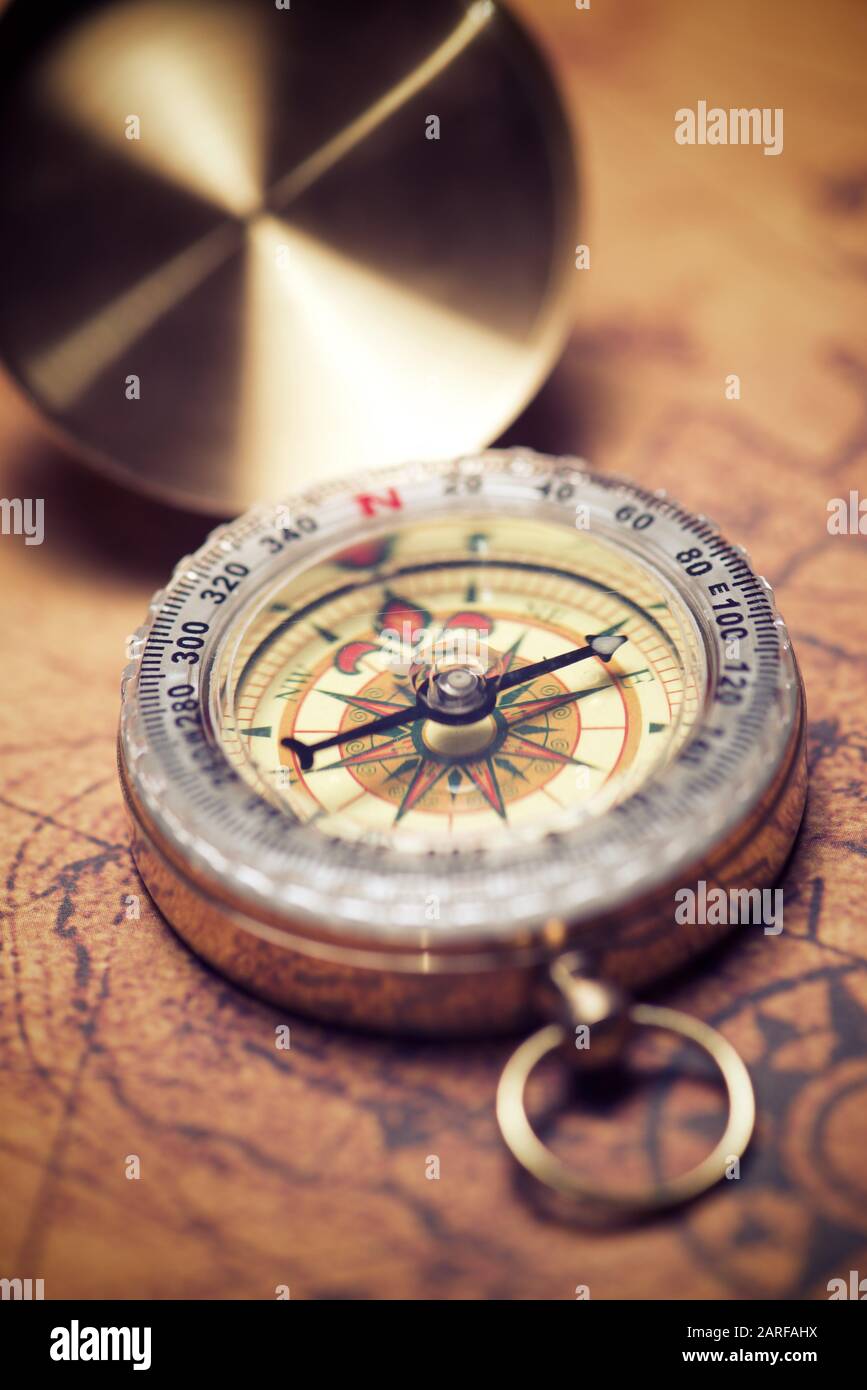 Vintage compass and old navigation map Stock Photo - Alamy