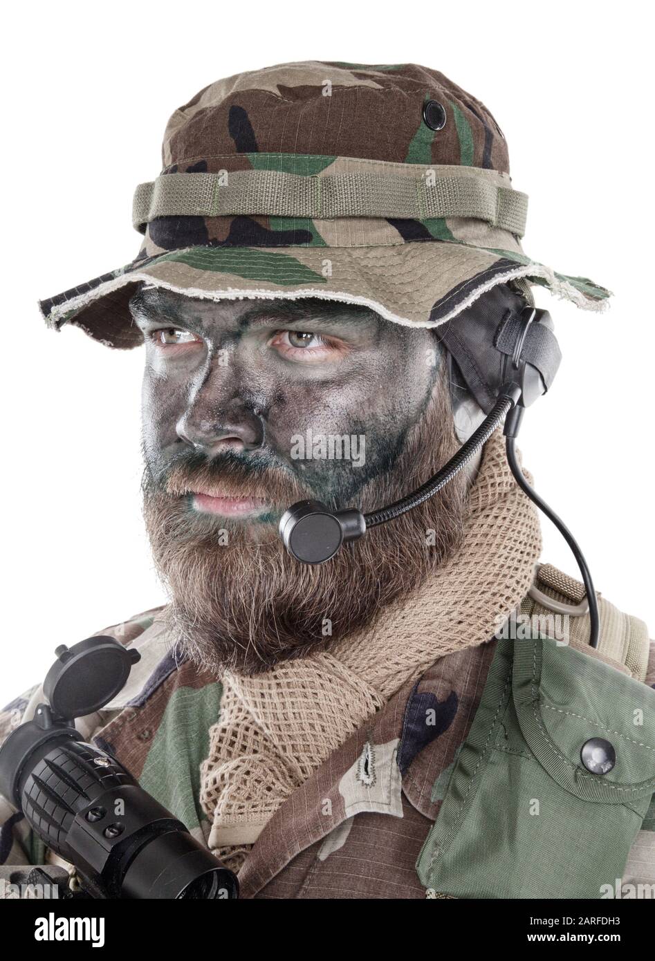 Shoulder studio portrait of commando soldier, modern mercenary,  professional soldier with black camouflage paint on bearded face, tactical  radio Stock Photo - Alamy