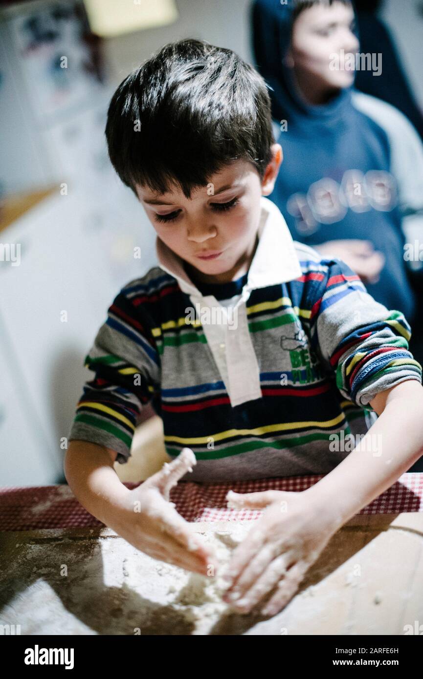 Child knead the dough with flour to make bread Stock Photo Alamy