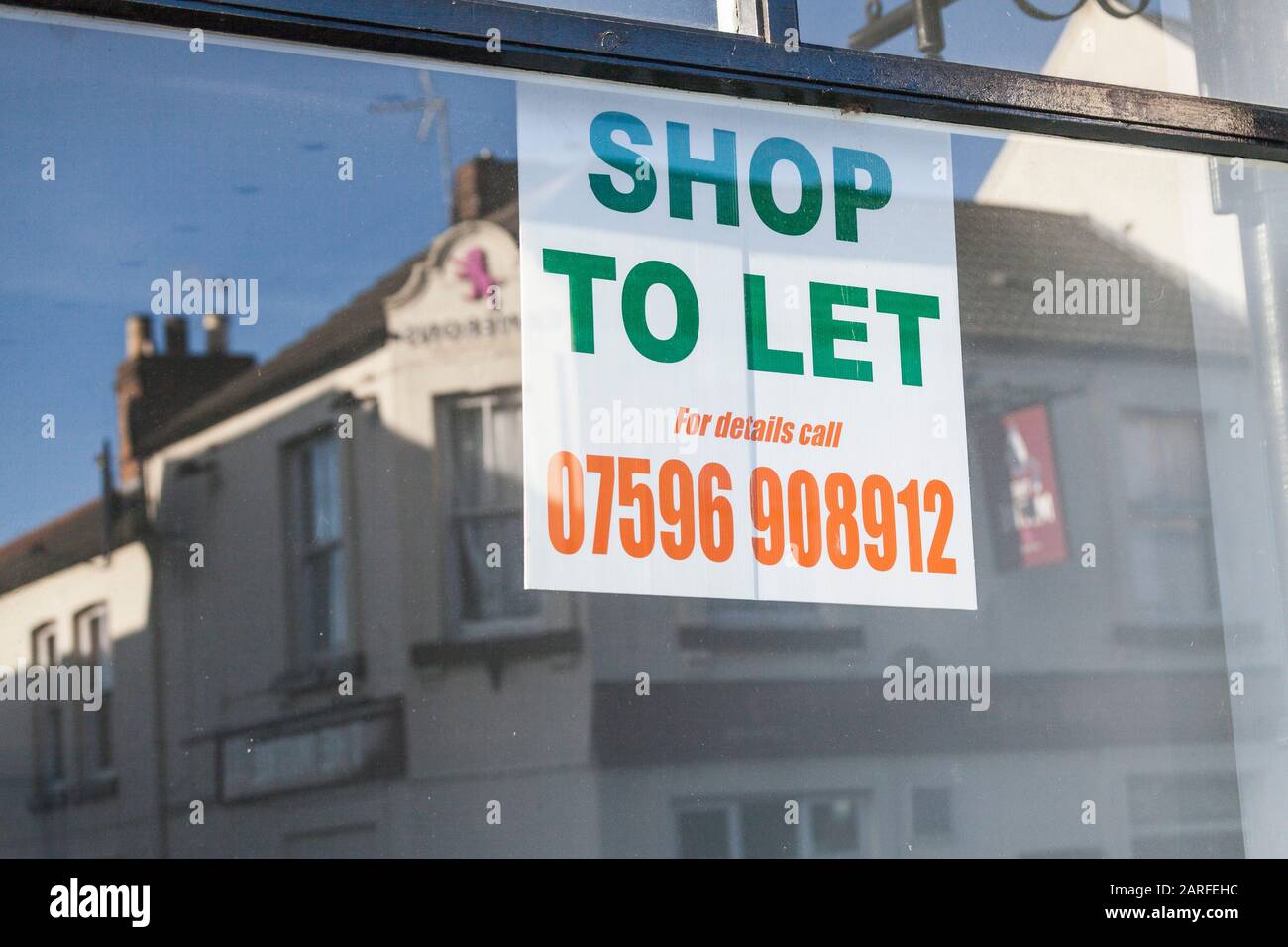A 'Shop to Let' sign in a window in Bishop Auckland,England,UK.Evidence of the decline in High Street shopping. Stock Photo