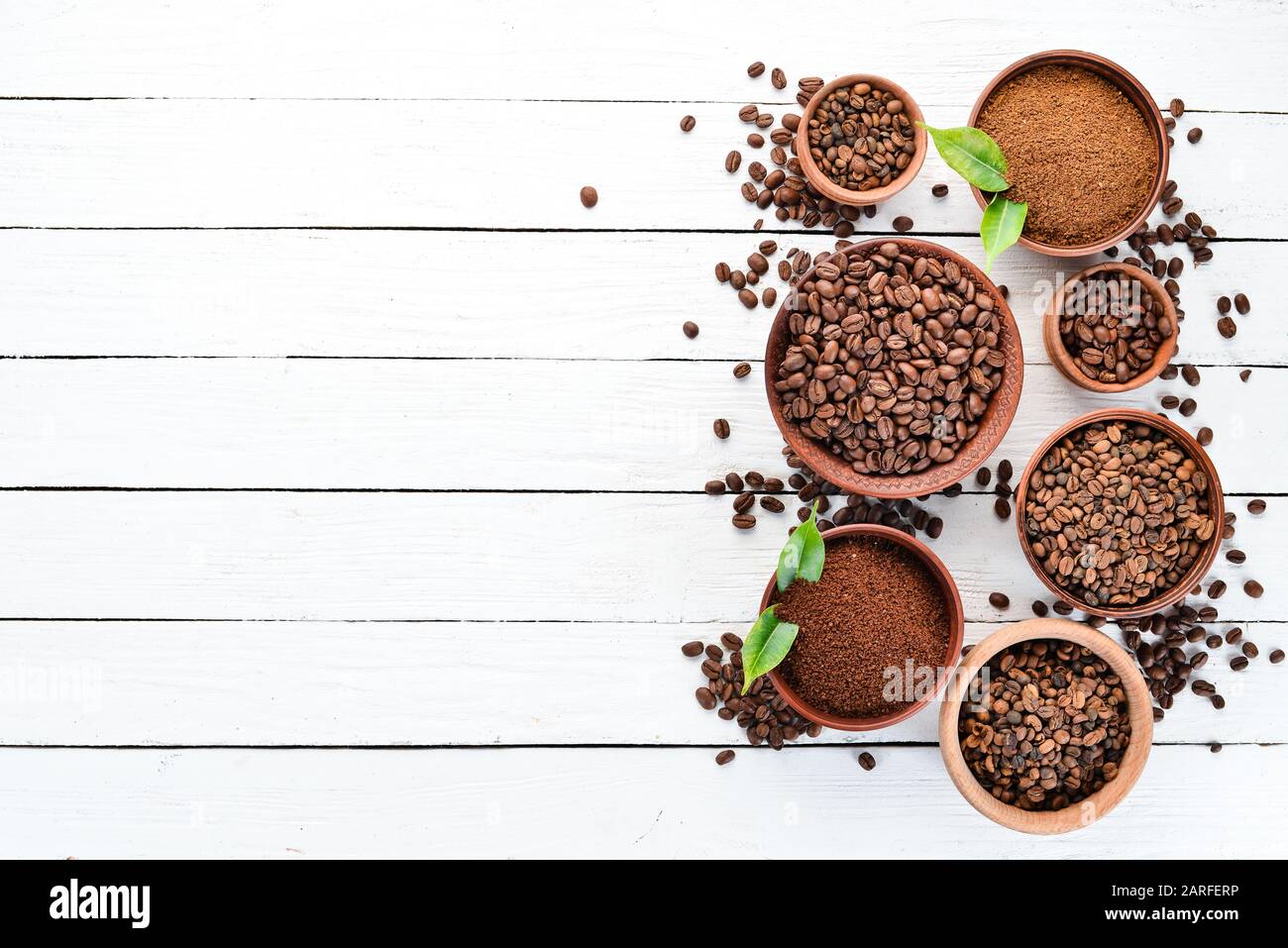 Ground Coffee And Coffee Beans On A White Wooden Background Top View Free Space For Your Text Stock Photo Alamy