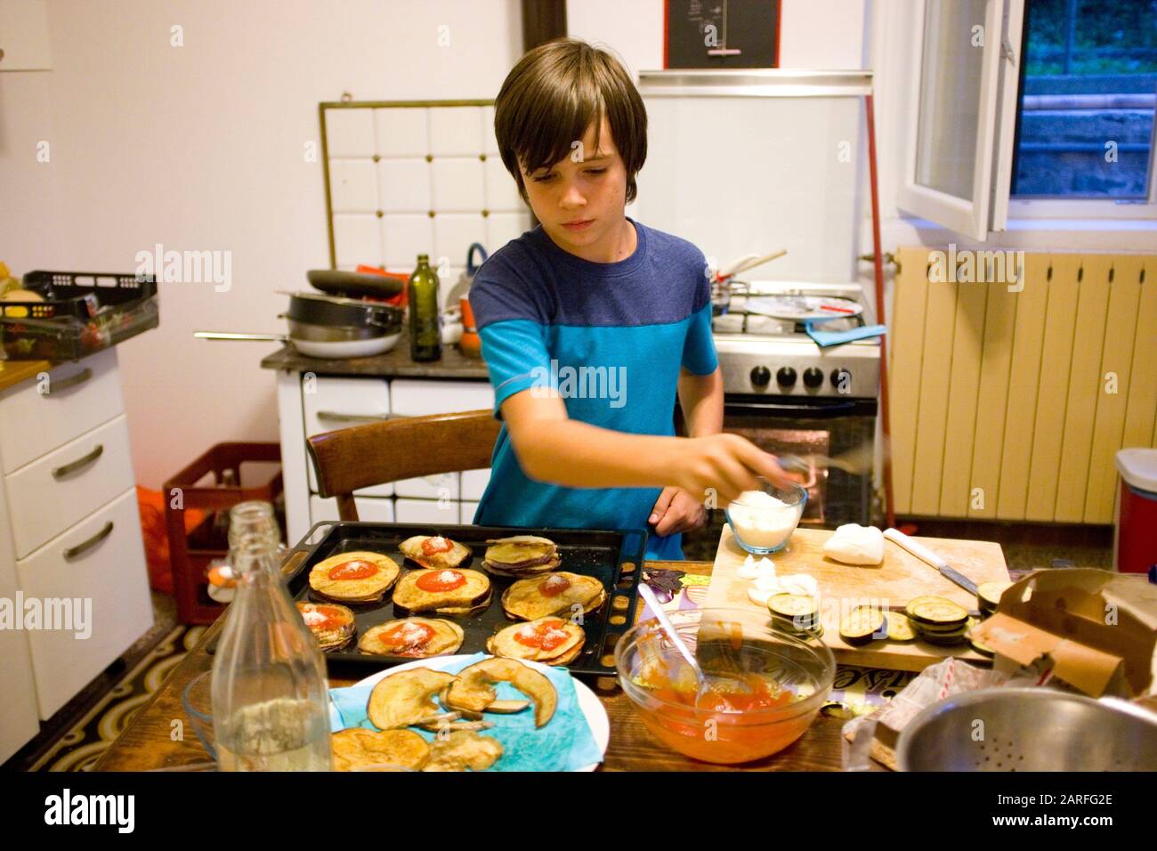 12 year old boy cooking Stock Photo - Alamy