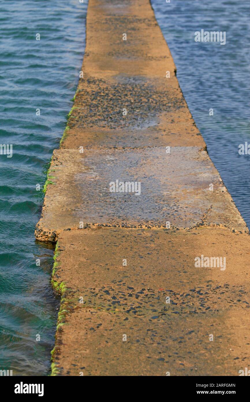 Stone boardwalk at rock pools on the beach, Salt Rock Hotel and Beach Resort, Salt Rock City, KwaZulu Natal, South Africa. Stock Photo