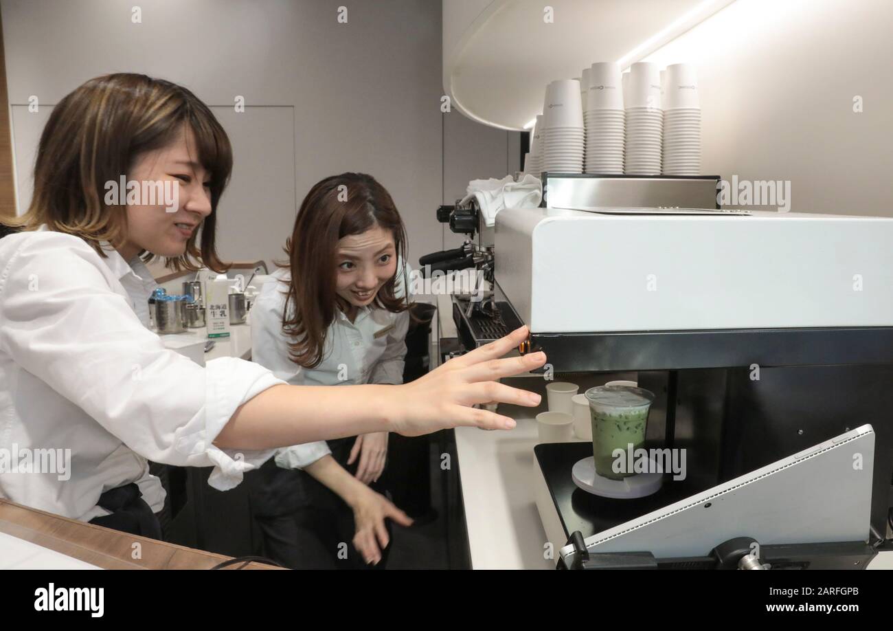 MACCHI-ART  PRINTS YOUR FACE ON A CAFE Stock Photo