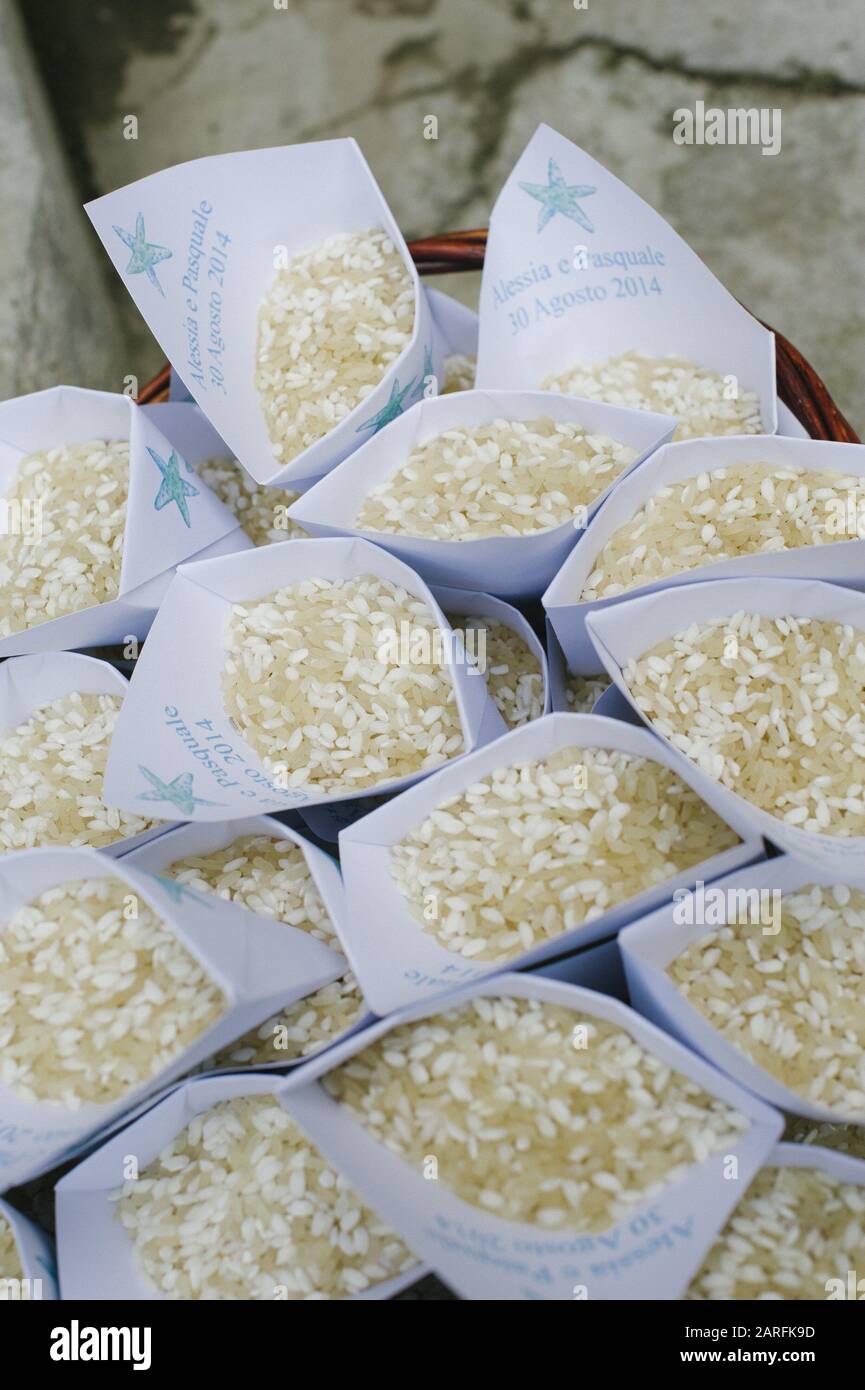 Rice to throw at the bride and groom leave the church Stock Photo Alamy