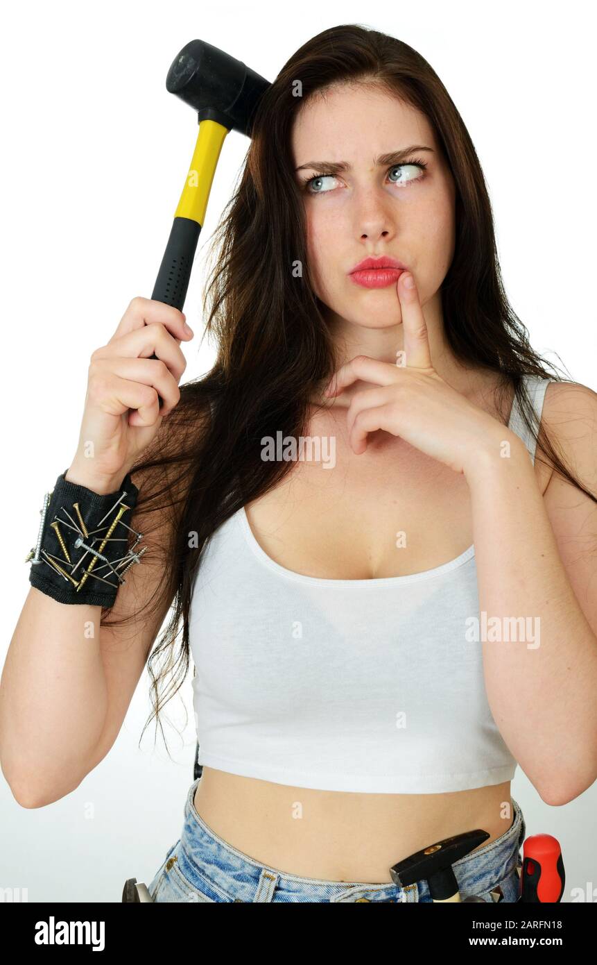 Young Girl Holding Hammer Near Her Head Confused Face Expression