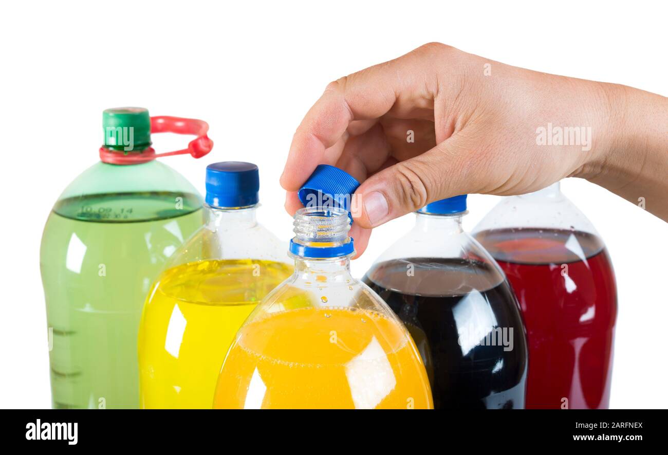 Carbonated drinks in plastic bottles. Multicolored drinks. Studio shot