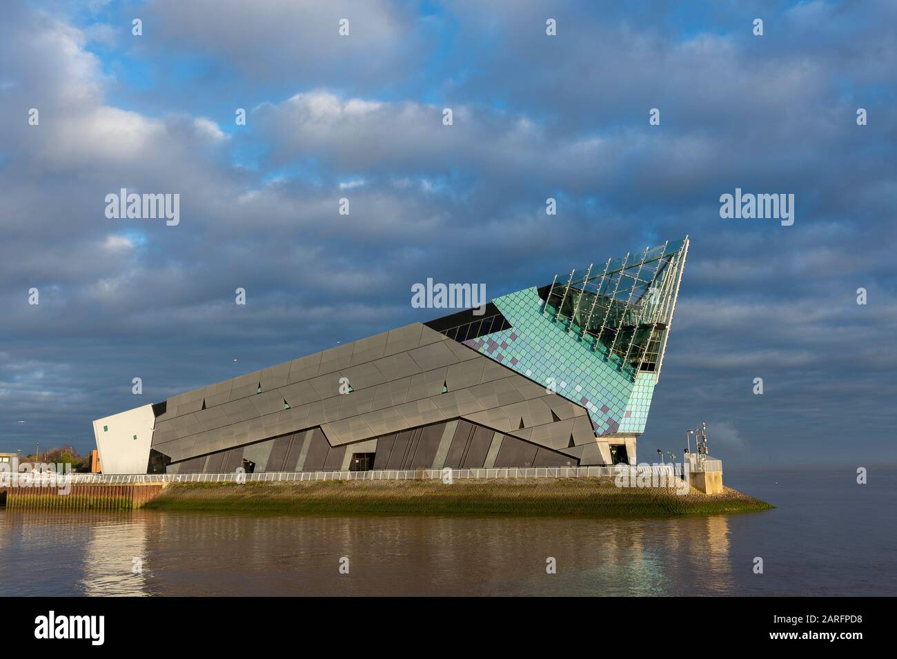Shown is The Deep Aquarium in Kingston Upon Hull. Hull's award-winning tourist attraction with 5,000 animals shown against a cloudy sky on The Humber Stock Photo