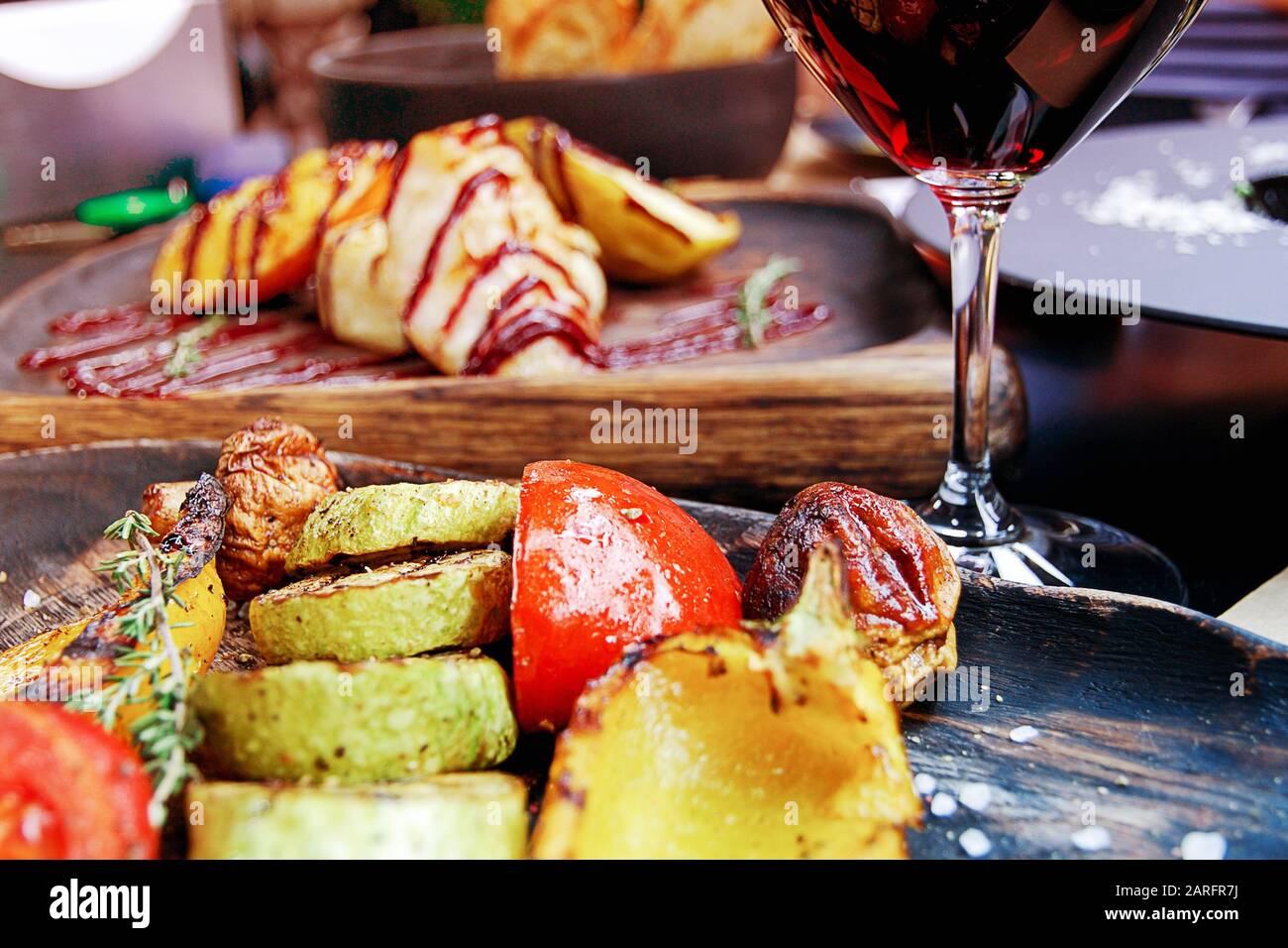 Simple tasty lunch with red wine  and grilled vegetables, seleclive focus Stock Photo