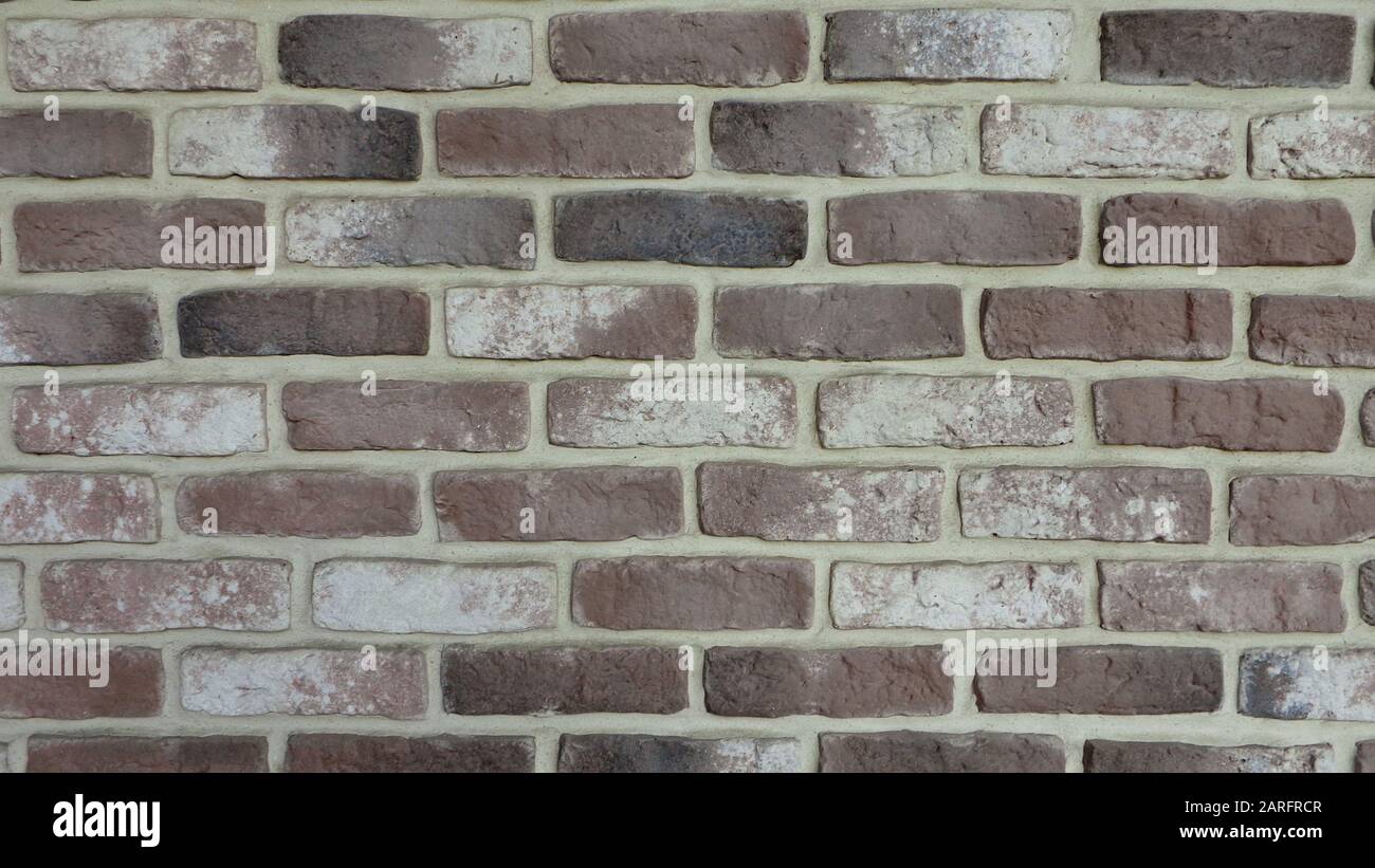 brick wall background in neutral brown tones Stock Photo