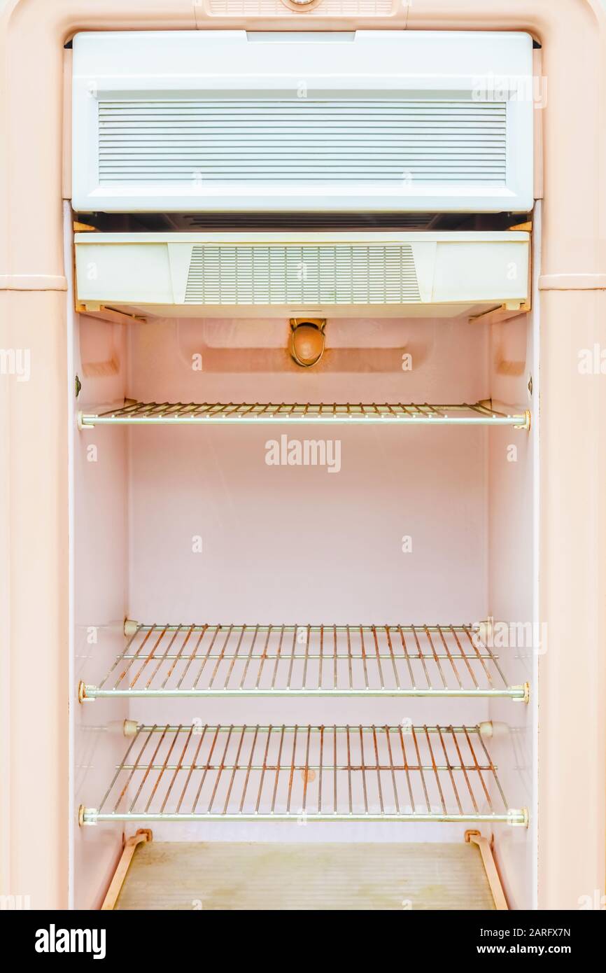 Interior of a retro pink fridge from the fifties Stock Photo
