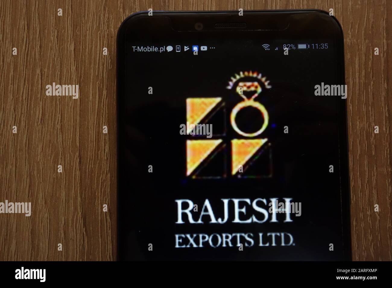 Rajesh Exports logo displayed on a modern smartphone Stock Photo