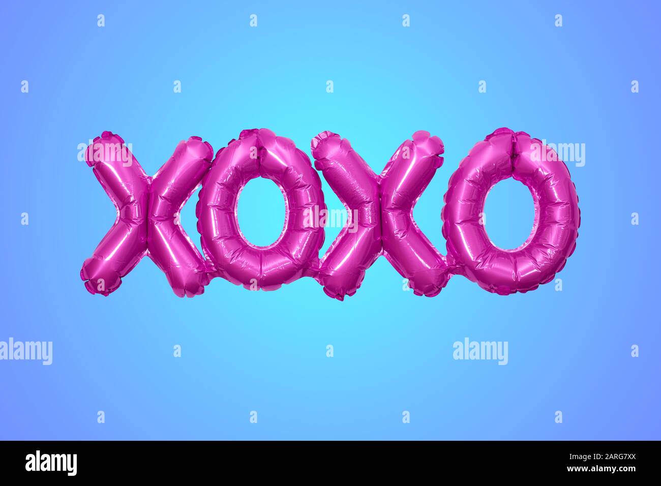 Inflated party balloon forming the letters XOXO meaning hugs and kisses Stock Photo