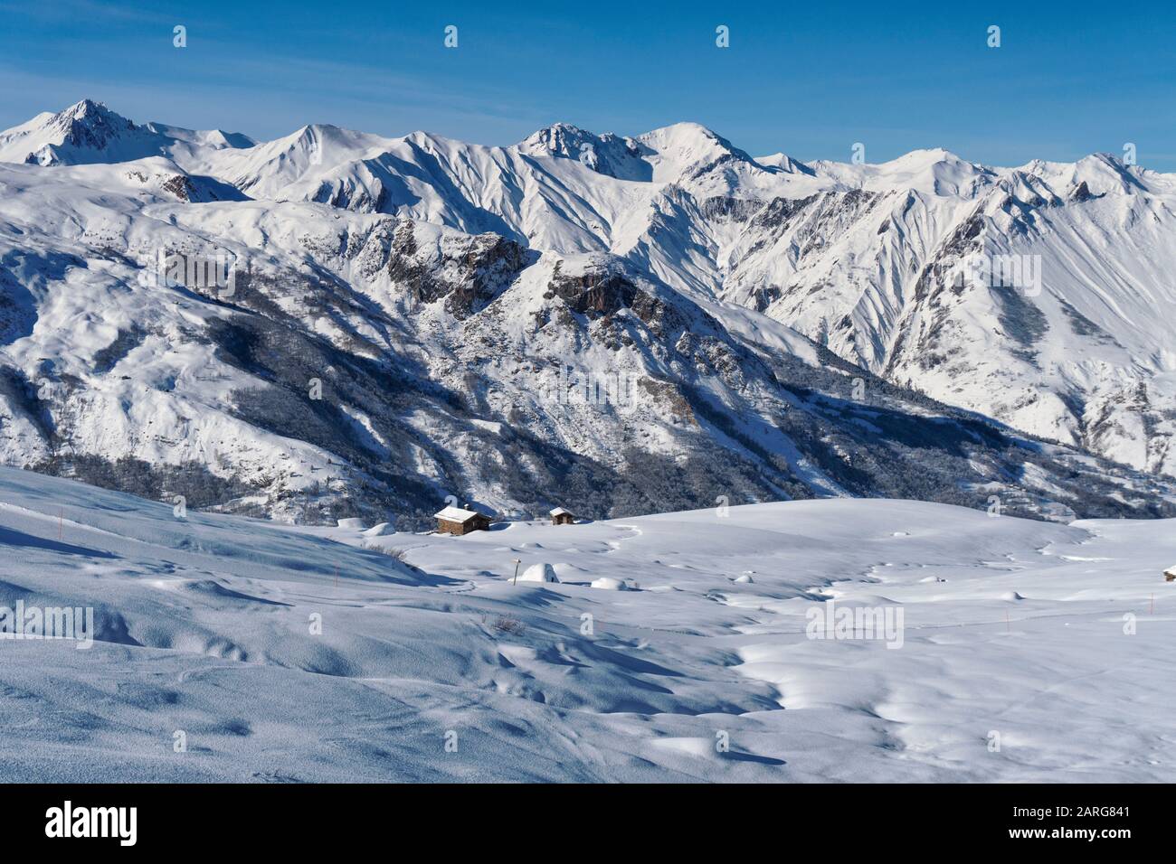 Snow covered barns on the slopes above the French ski resort of St Martin de Belleville in the 3 valleys Stock Photo