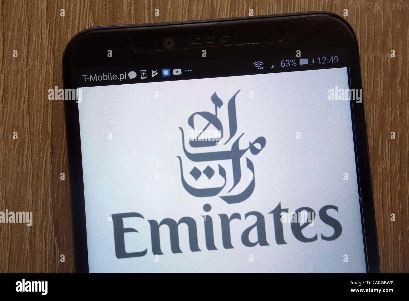 Emirates logo displayed on a modern smartphone Stock Photo