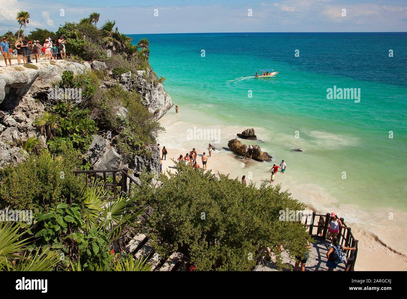View to the people swimming and sunbathing at the beach close to the Tulum Archaeological Site, Tulum, Quintana Roo, Mexico, Central America Stock Photo
