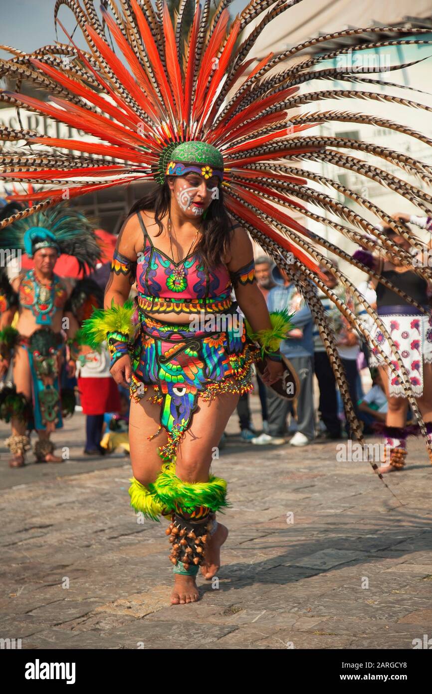 Indigenous Dancers In Traditional Costumes During The Virgen De Guadalupe Festival Near Basilica