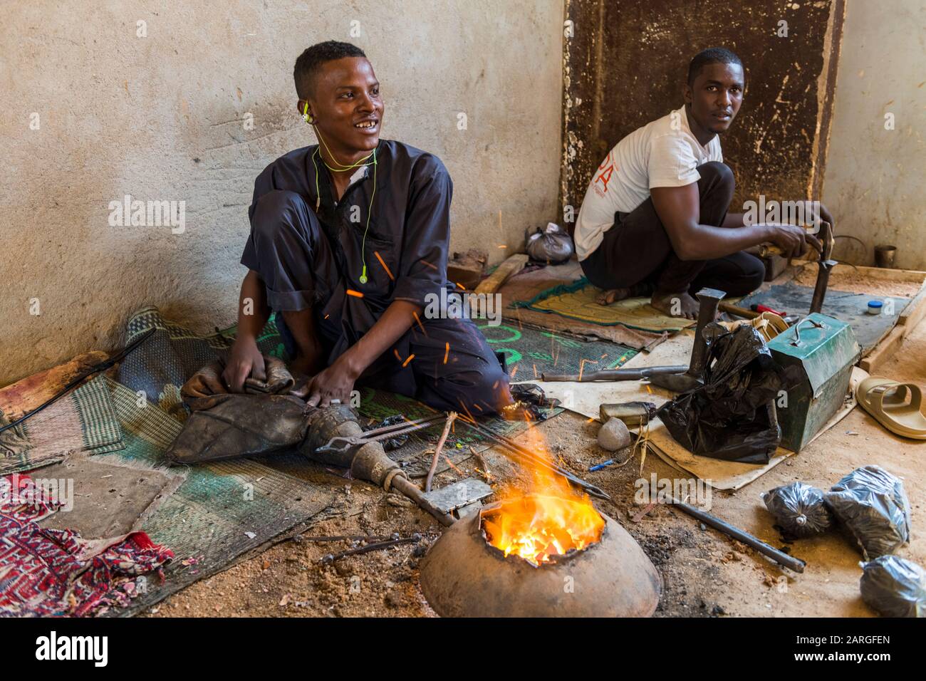 Man working on Jewllery in the UNESCO World Heritage Site, Agadez, Niger, West Africa, Africa Stock Photo
