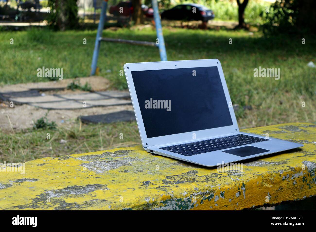 Photo of laptop computer at an outdoor park Stock Photo - Alamy