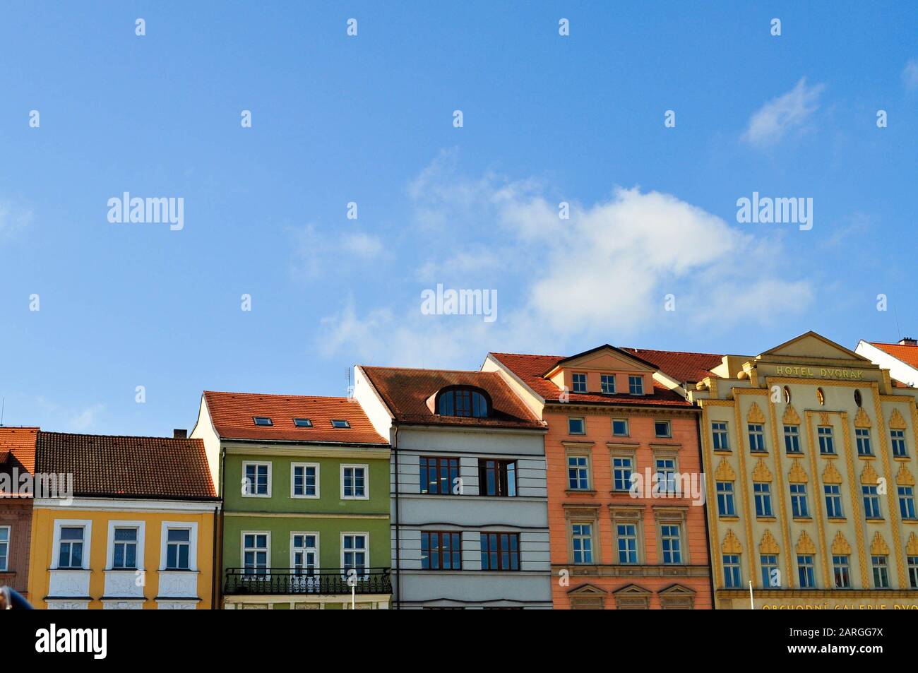 Typical colorful houses buildings with multicolored facade and windows, blue sky background in budweis czech republic Stock Photo