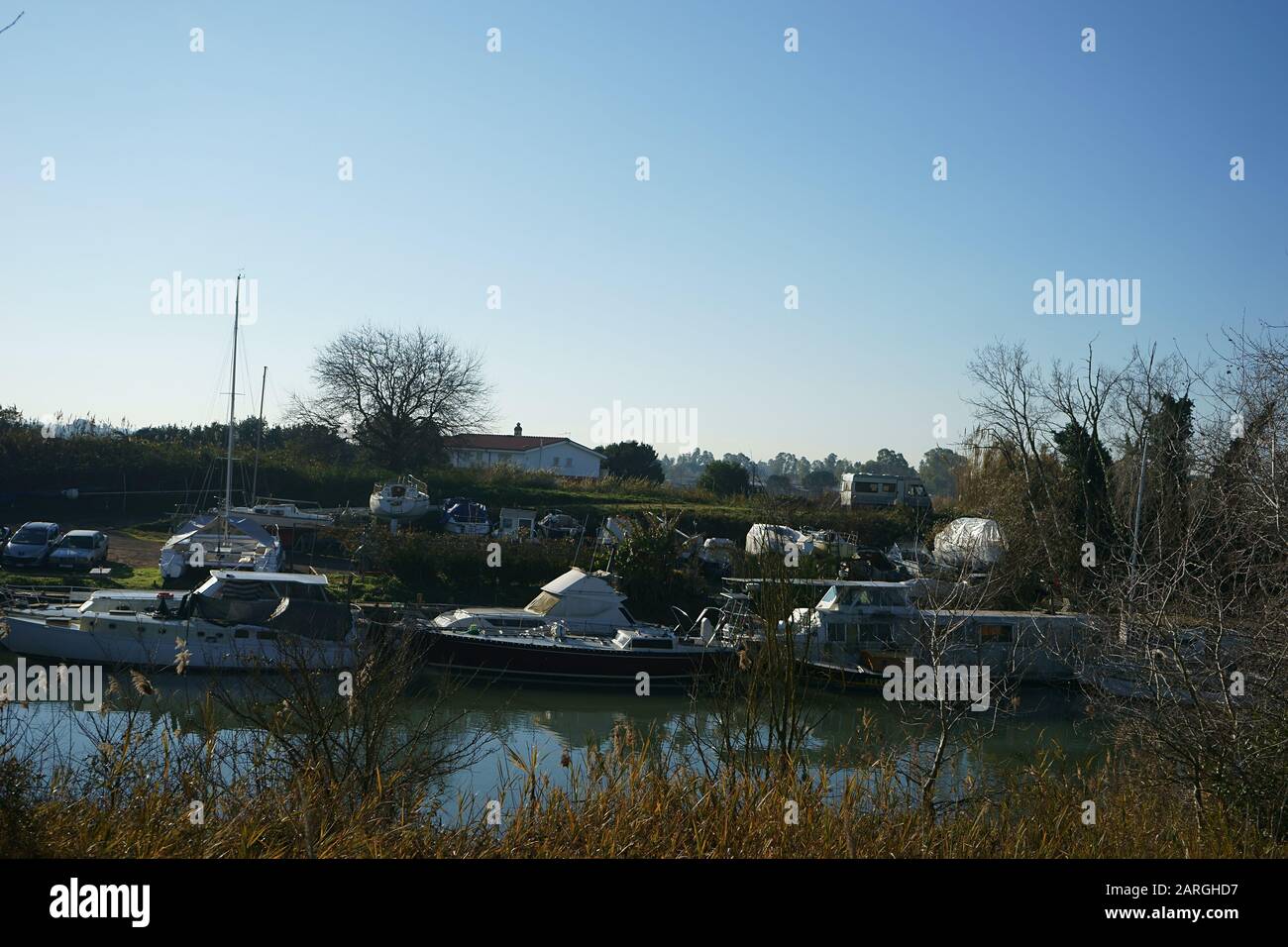 Boats, Tevere River, near Fiumicino, Rome, Italy Stock Photo