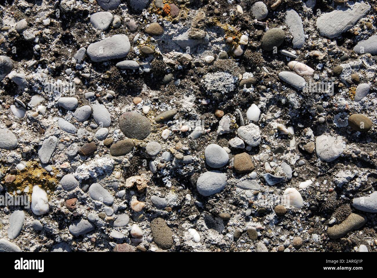 Old stone wall texture with pebbles Stock Photo