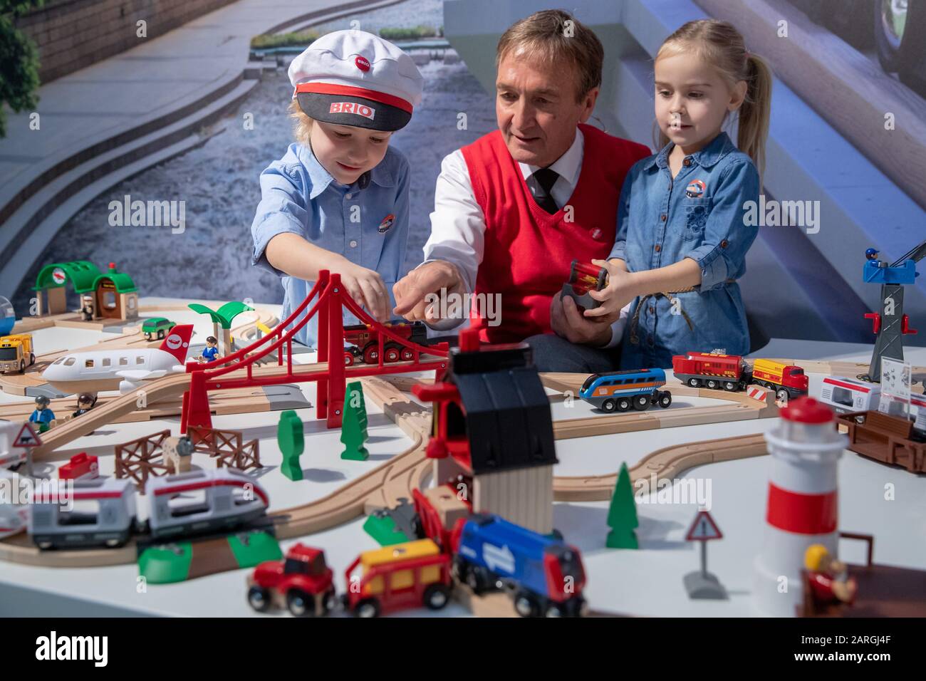 Nuremberg, Germany. 28th Jan, 2020. Ludwig (l), Klaus and Elsa play Smart Tech Sound with the wooden train from Brio (Ravensburger Verlag) during the new products show at the International Toy Fair. Credit: Daniel Karmann/dpa/Alamy Live News Stock Photo