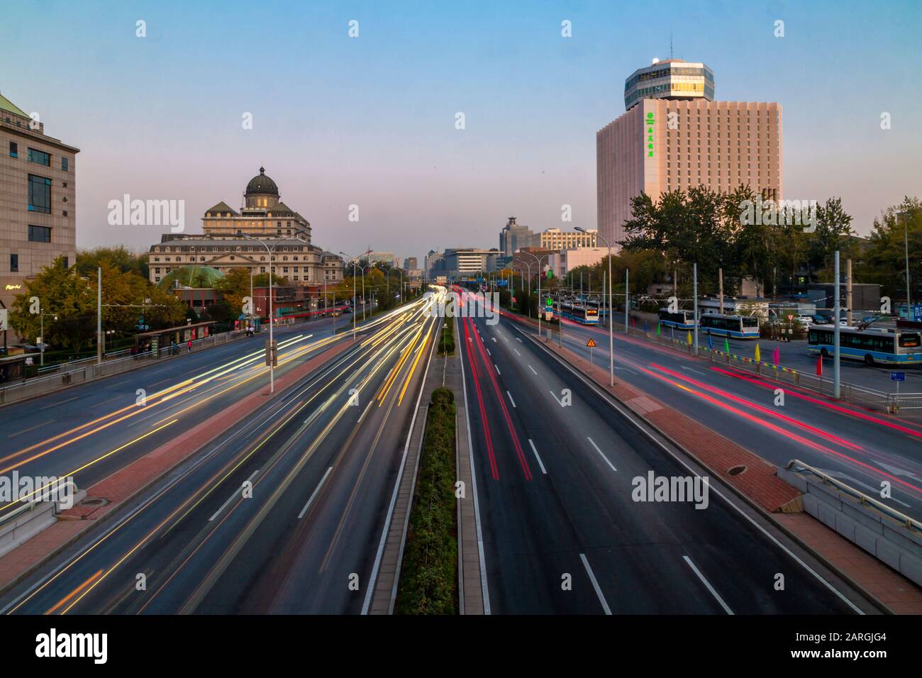 Traffic trail lights on major road near Beijing Zoo at dusk, Beijing, People's Republic of China, Asia Stock Photo