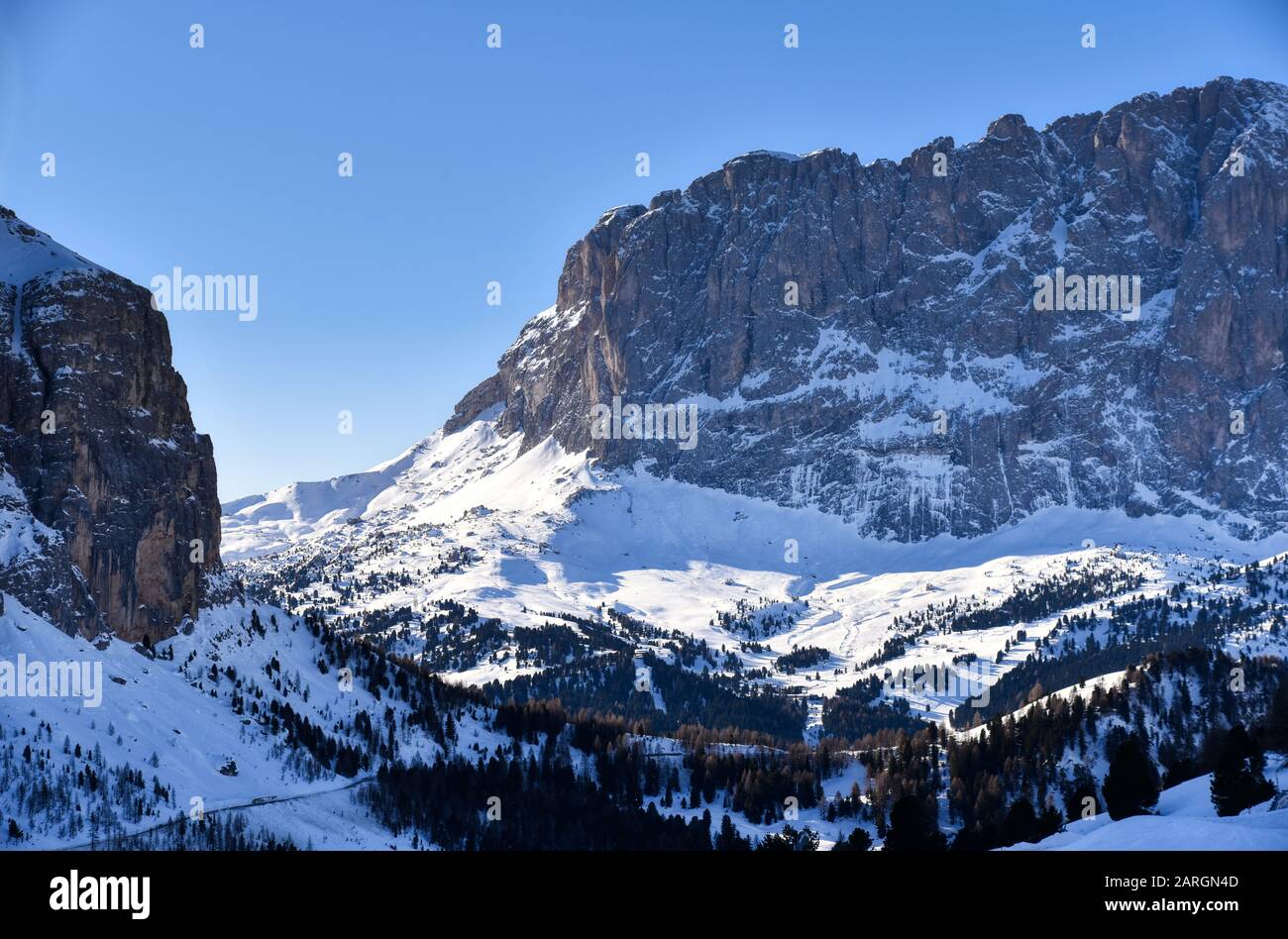 From Passo Gardena the road descends towards the Passo Sella and skirting  the Sasso Lungo massif Stock Photo - Alamy